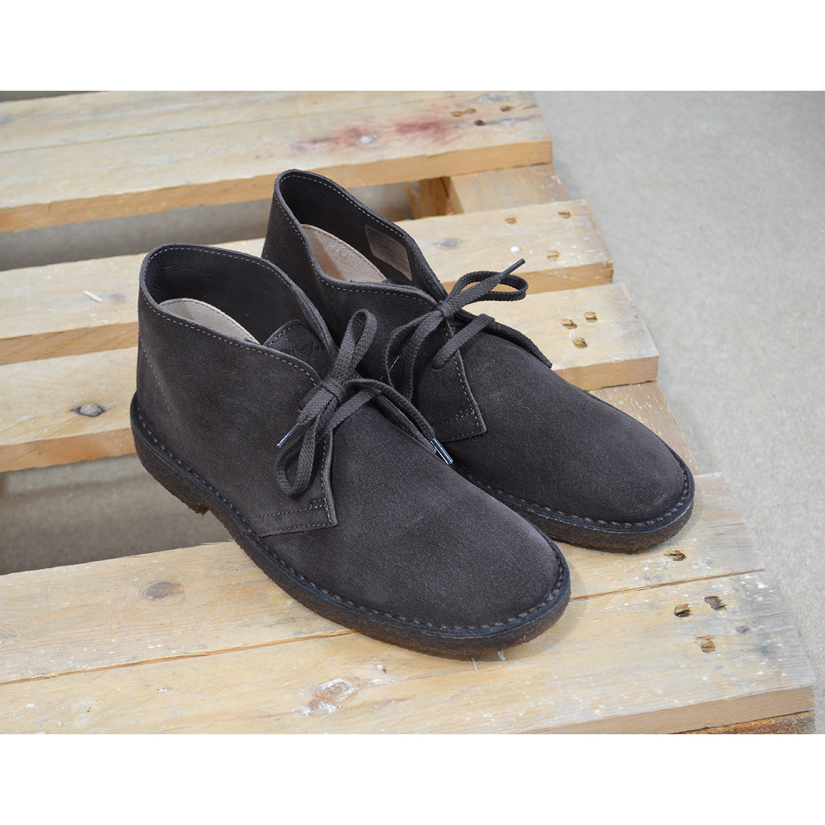 A brown Astorflex Montflex unlined boot with a lace-up closure, made from reverse suede, showcasing the natural rubber sole.