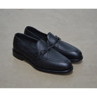 A Berwick 1707 classic black unlined laced slip-on loafer with a Goodyear welted leather sole.