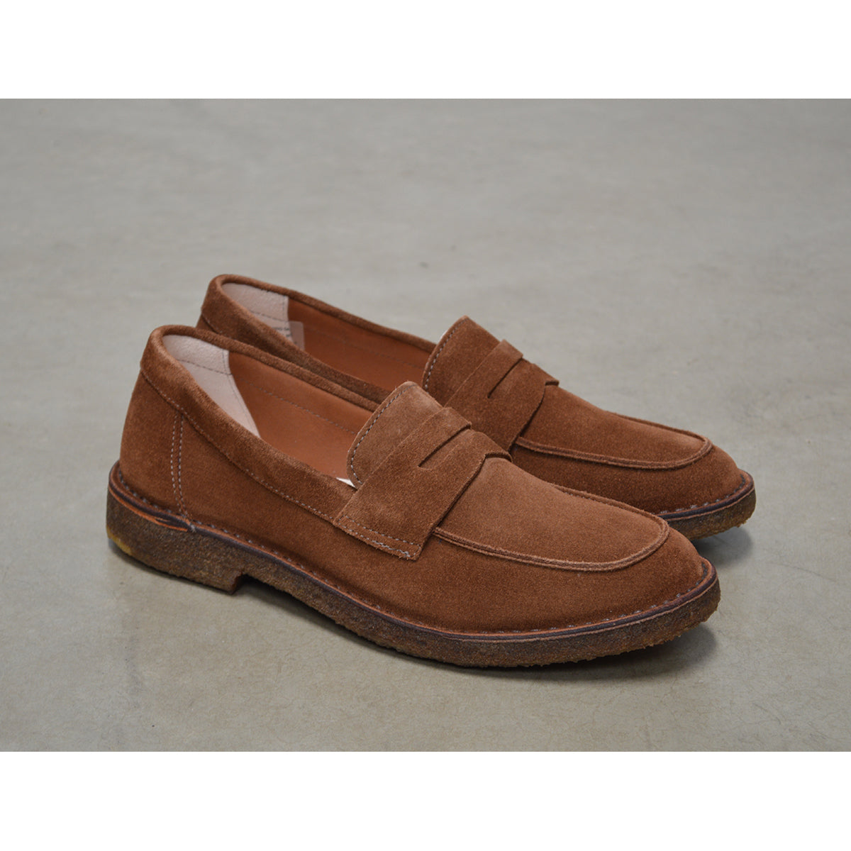 A brown Astorflex Sadelflex Loafer with soft suede upper and crepe rubber sole