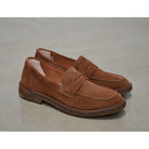 A brown Astorflex Sadelflex Loafer with soft suede upper and crepe rubber sole