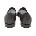 A dark brown deerskin leather Belgian loafer with an almond toe shape and minimal stitching.