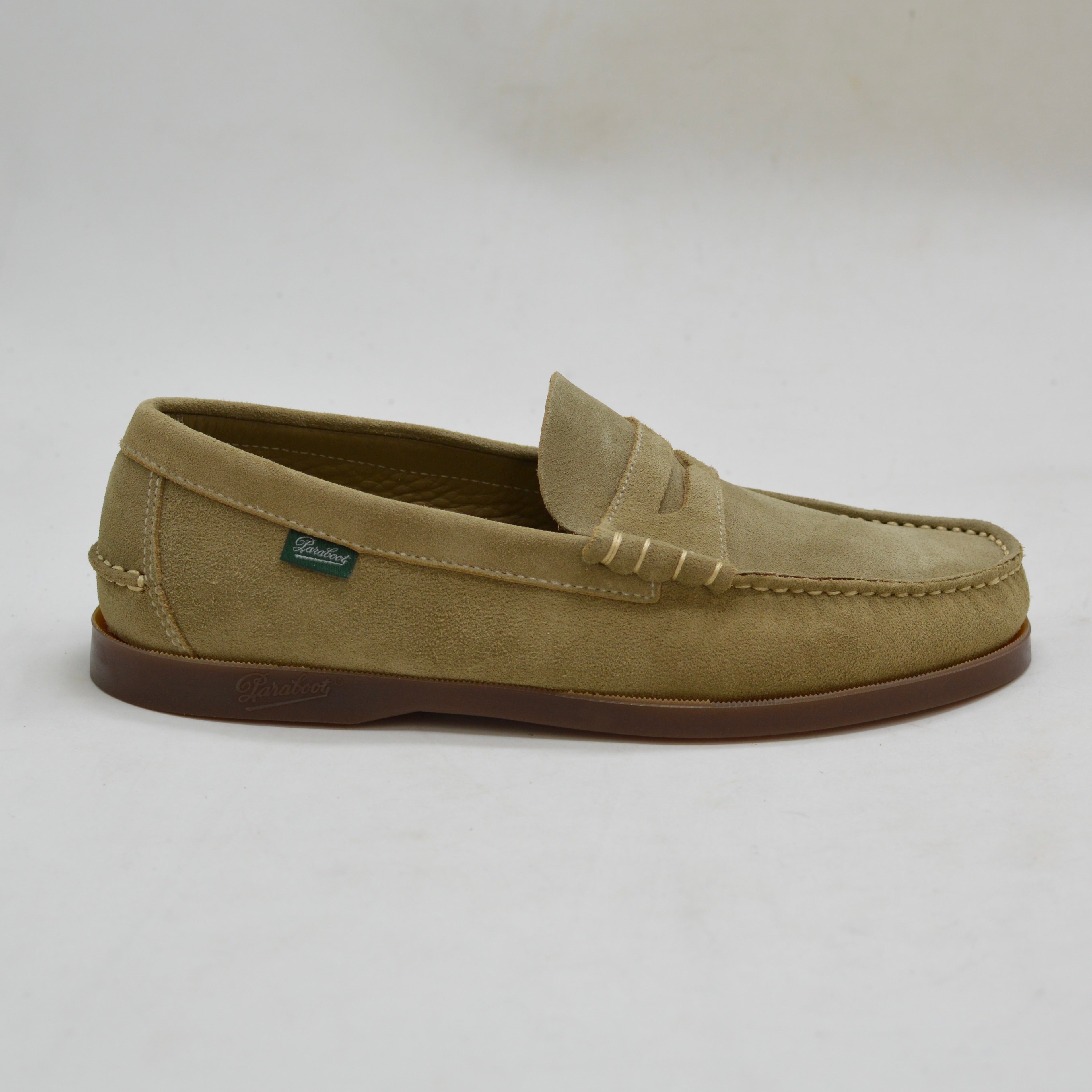 Sand loafer shoe on a light gray background