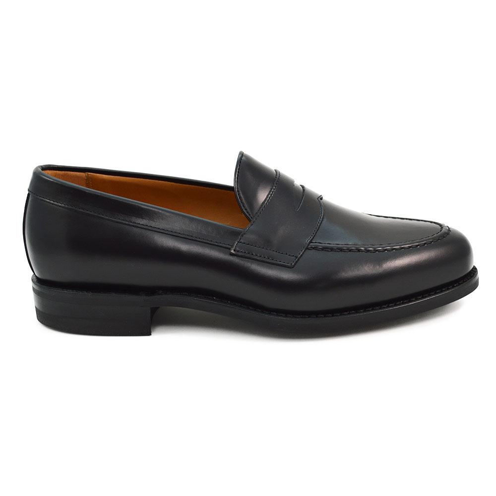 A black high-shine Berwick 1707 Penny Loafer with a round toe and Dainite rubber sole.