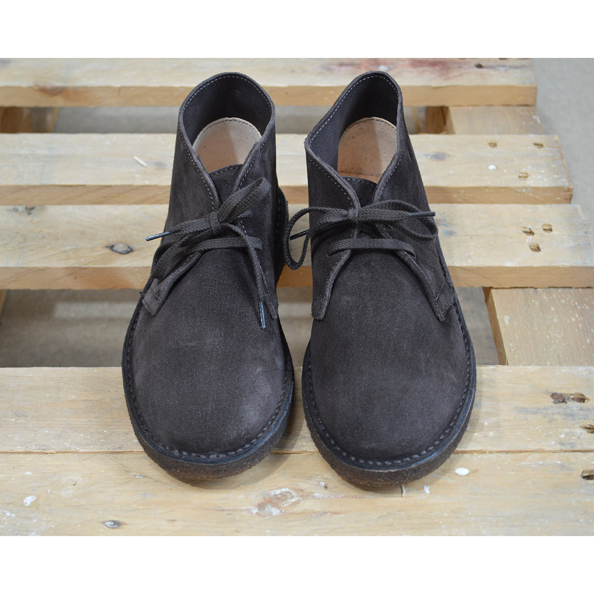 A brown Astorflex Montflex unlined boot with a lace-up closure, made from reverse suede, showcasing the natural rubber sole.