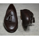 A Berwick 1707 dark brown deerskin Belgian loafer with a tassel detail on the vamp