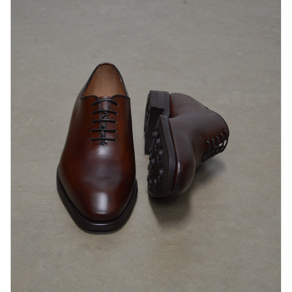 A Berwick 1707 brown leather wholecut oxford shoe with a lace-up closure and a round toe.