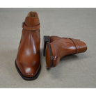 A brown Berwick 1707 JODHPUR 490 ankle boot with a buckle strap and Goodyear welted sole.