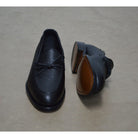 A Berwick 1707 classic black unlined laced slip-on loafer with a Goodyear welted leather sole.