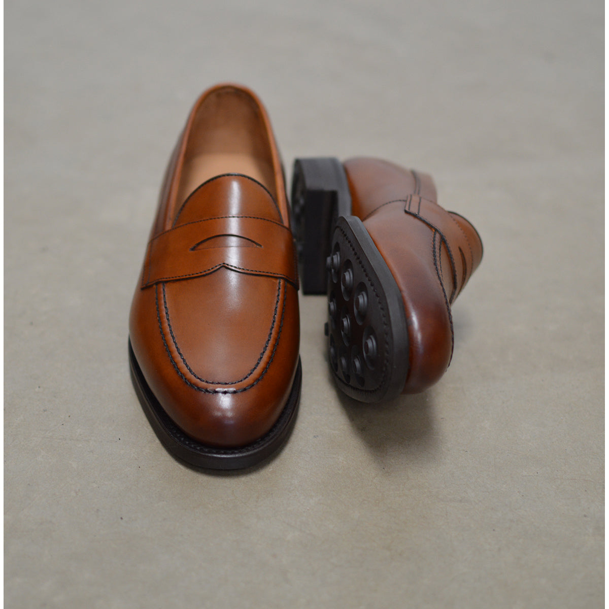 Berwick 1707 Brown tan leather loafer shoe on a polished concrete background with Dainite Soles