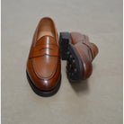 Berwick 1707 Brown tan leather loafer shoe on a polished concrete background with Dainite Soles
