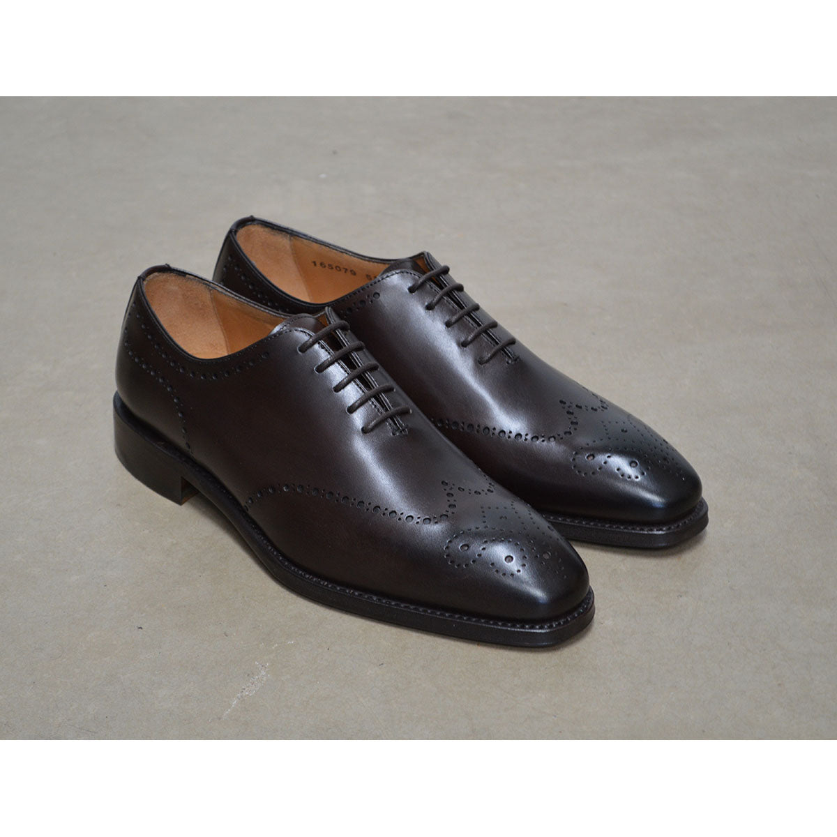 A Berwick 1707 moka brown wholecut Oxford brogue shoe with a goodyear welted leather sole, last week, and a smooth finish.