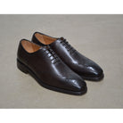 A Berwick 1707 moka brown wholecut Oxford brogue shoe with a goodyear welted leather sole, last week, and a smooth finish.