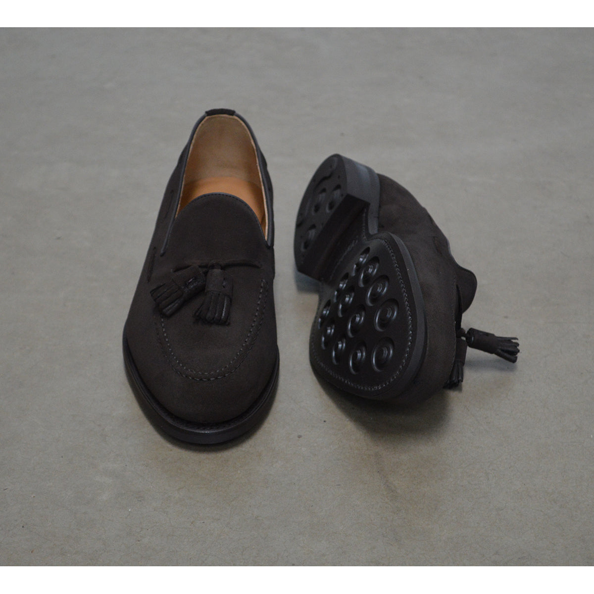 A classic dark brown suede slip-on shoe with tassels, by Berwick 1707, with a goodyear welted dainite sole.