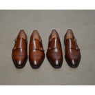 A brown Berwick 1707 double monk shoe with double buckle monk strap on polished concrete 
