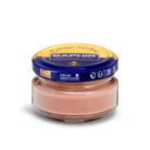 A jar of Saphir Creme Surfine shoe polish with a label on the lid.