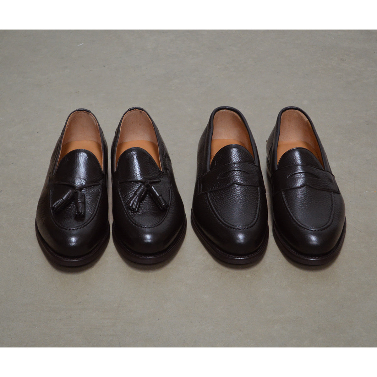 A Berwick 1707 dark brown &deerskin slip-on loafer with a tassel detail on the vamp & Dainite sole