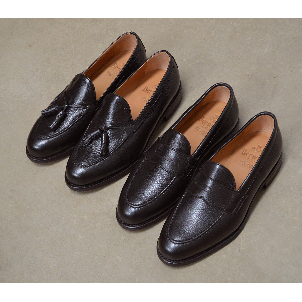 A Berwick 1707 dark brown deerskin slip-on loafer with a tassel detail on the vamp & Dainite sole
