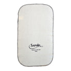 White cloth with Saphir logo on a white background