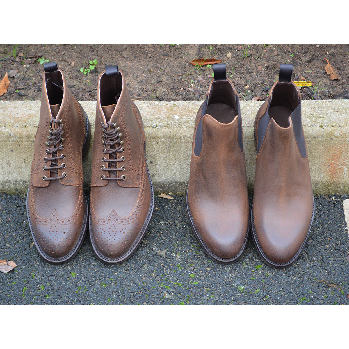 A dark brown lace-up brogue boot with a rubber sole and visible stitching on the upper part.