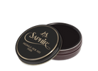 A round tin container of Saphir Medaille D'Or shoe wax polish with black lid and gold lettering.
