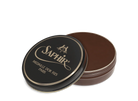 A round tin container of Saphir Medaille D'Or shoe wax polish with black lid and gold lettering.