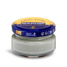 A jar of Saphir Creme Surfine shoe polish with a label on the lid.