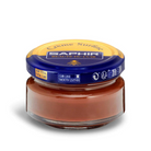 A jar of Saphir Creme Surfine shoe polish with a label on the lid.