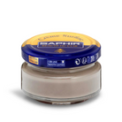 A jar of Saphir Creme Surfine shoe polish with a label on the lid.