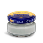 A jar of Saphir Creme Surfine shoe polish with a label on the lid.