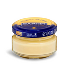 A jar of Saphir Creme Surfine shoe polish with a label on the lid.
