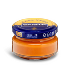A jar of Saphir Creme Surfine shoe polish with a label on the lid.
