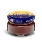 A jar of Saphir Creme Surfine shoe polish with a label on the lid.