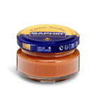A jar of Saphir Creme Surfine shoe polish with a label on the lid.