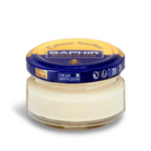 A jar of Saphir Creme Surfine shoe polish with a label on the lid.