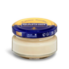A jar of Saphir Creme Surfine shoe polish with a label on the lid.