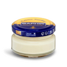 A jar of Saphir Creme Surfine shoe polish with a label on the lid.