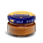 A jar of Saphir Creme Surfine shoe polish with a label on the lid.