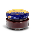A jar of Saphir Creme Surfine shoe polish with a label on the lid.