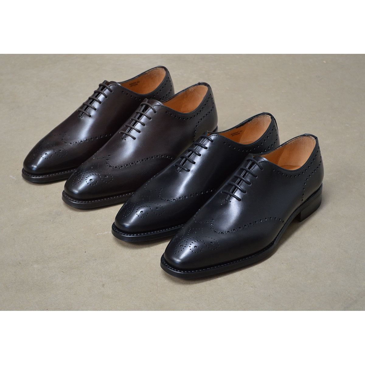 A Berwick 1707 moka brown & black wholecut Oxford brogue shoes with a goodyear welted leather sole, last week, and a smooth finish.