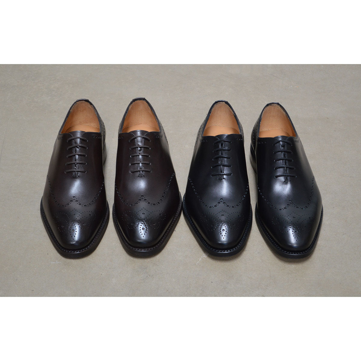 A Berwick 1707 moka brown & black wholecut Oxford brogue shoes with a goodyear welted leather sole, last week, and a smooth finish.