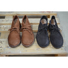 A brown Astorflex Montflex unlined boot with a lace-up closure, made from reverse suede, showcasing the natural rubber sole.