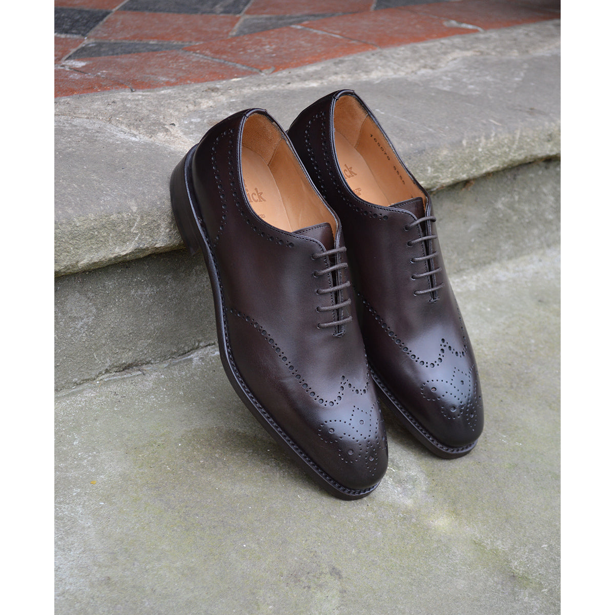 A Berwick 1707 moka brown wholecut Oxford brogue shoes with a goodyear welted leather sole, last week, and a smooth finish.
