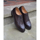 A Berwick 1707 moka brown wholecut Oxford brogue shoes with a goodyear welted leather sole, last week, and a smooth finish.