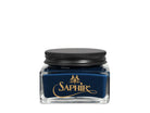 A glass jar with a black lid labeled 'SAPHIR' containing cream shoe polish.