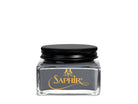 A glass jar with a black lid labeled 'SAPHIR' containing cream shoe polish.