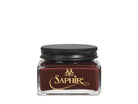 A glass jar with a black lid labeled 'SAPHIR' containing cream shoe polish.