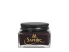 A glass jar with a black lid labeled 'SAPHIR' containing cream shoe polish.