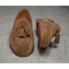 A brown suede tassel Berwick 1707 Belgian loafer with a combination leather and fine rubber sole.