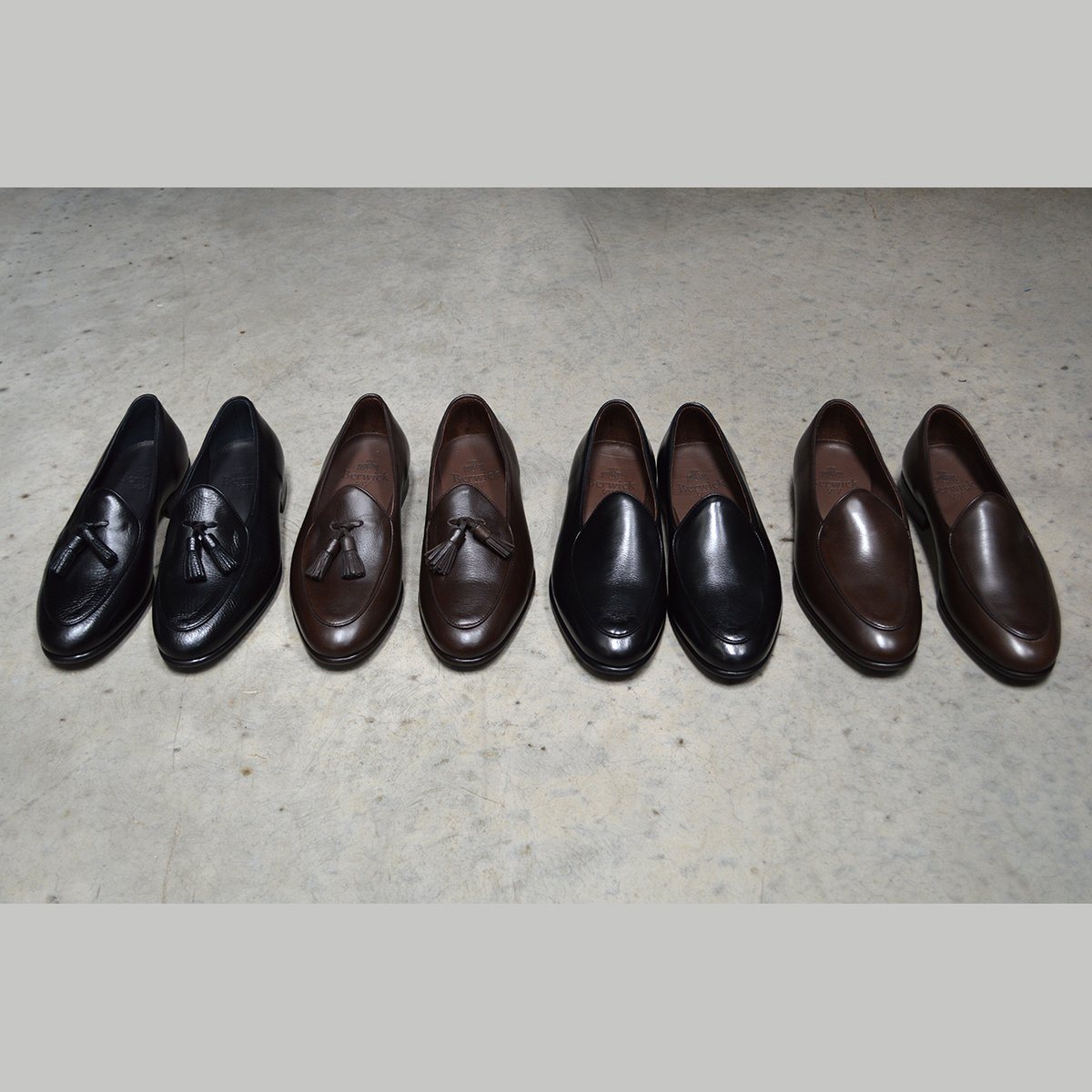 A classic black & brown Berwick 1707 Belgian loafer with a smooth deerskin leather upper, an almond toe shape, and a low heel.