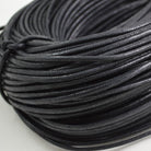 coloured waxed round casual shoe laces, tied in individual bundles.
